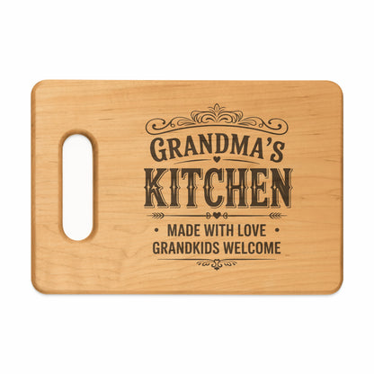 Wooden cutting board with text "Grandma's Kitchen Made With Love Grandkids Welcome".