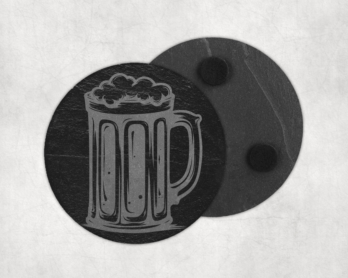 Slate coaster with etched beer mug design on textured background.