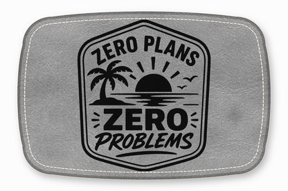 Gray faux-leather patch featuring a black badge emblem with a sunset, palm tree, and the text "Zero Plans Zero Problems."