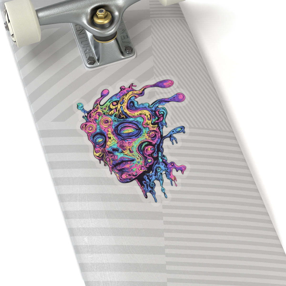 Psychedelic melting face sticker on a skateboard deck with silver truck.