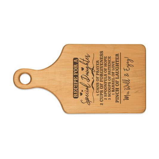 Wooden cutting board with "Recipe for a Special Daughter" and ingredients.