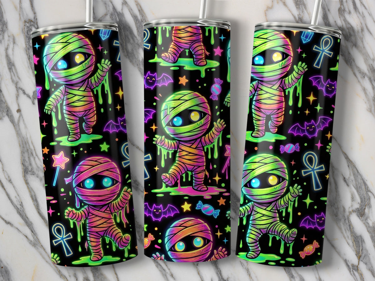 Three tumblers feature a neon-style mummy design with bats, candy, and stars.