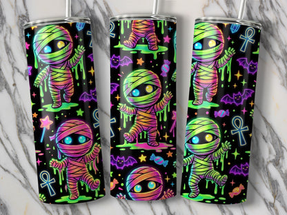 Three tumblers feature a neon-style mummy design with bats, candy, and stars.