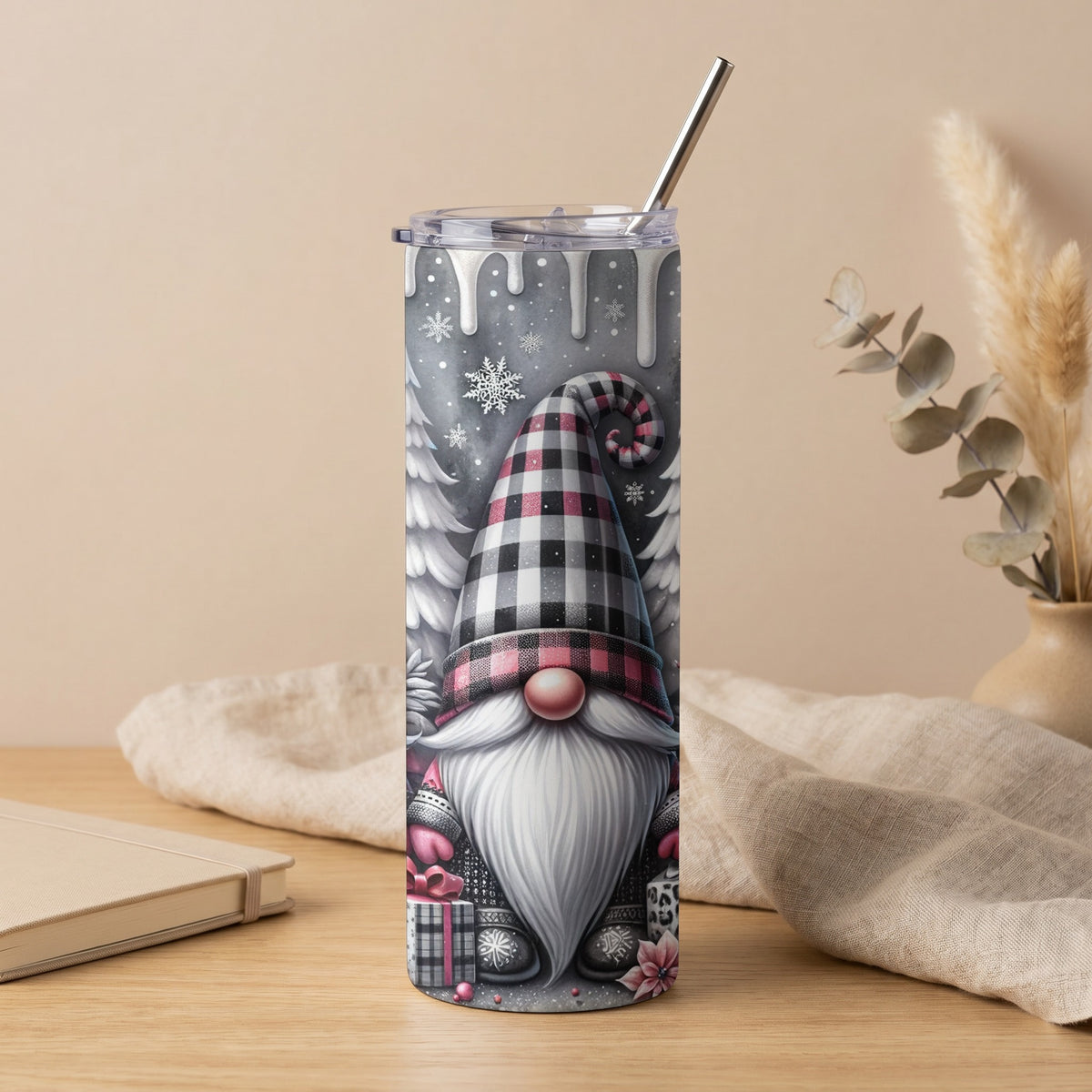 Tall tumbler with a Christmas gnome and snowflakes design, featuring a plaid hat and gifts.