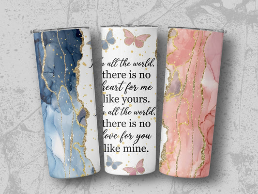 Three tumblers with marble and gold designs, one with text about love.