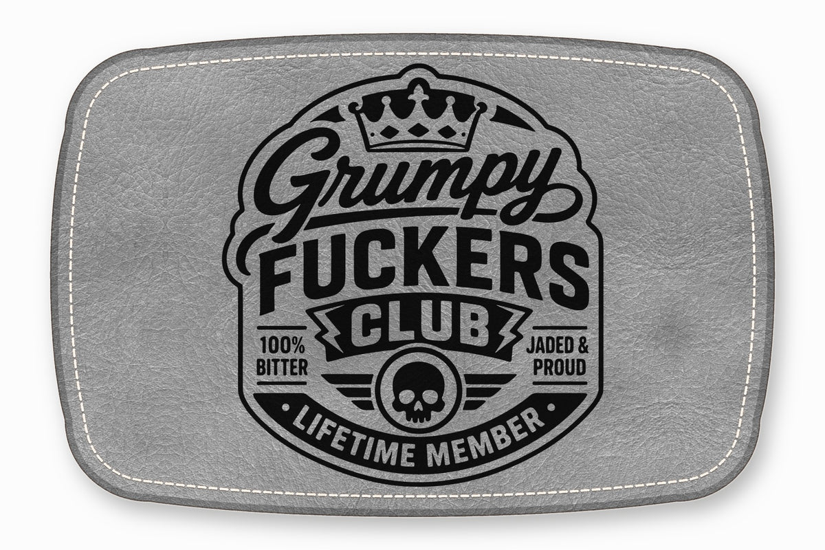 Grey leather patch with white stitched border featuring a black graphic and text reading Grumpy Fuckers Club.