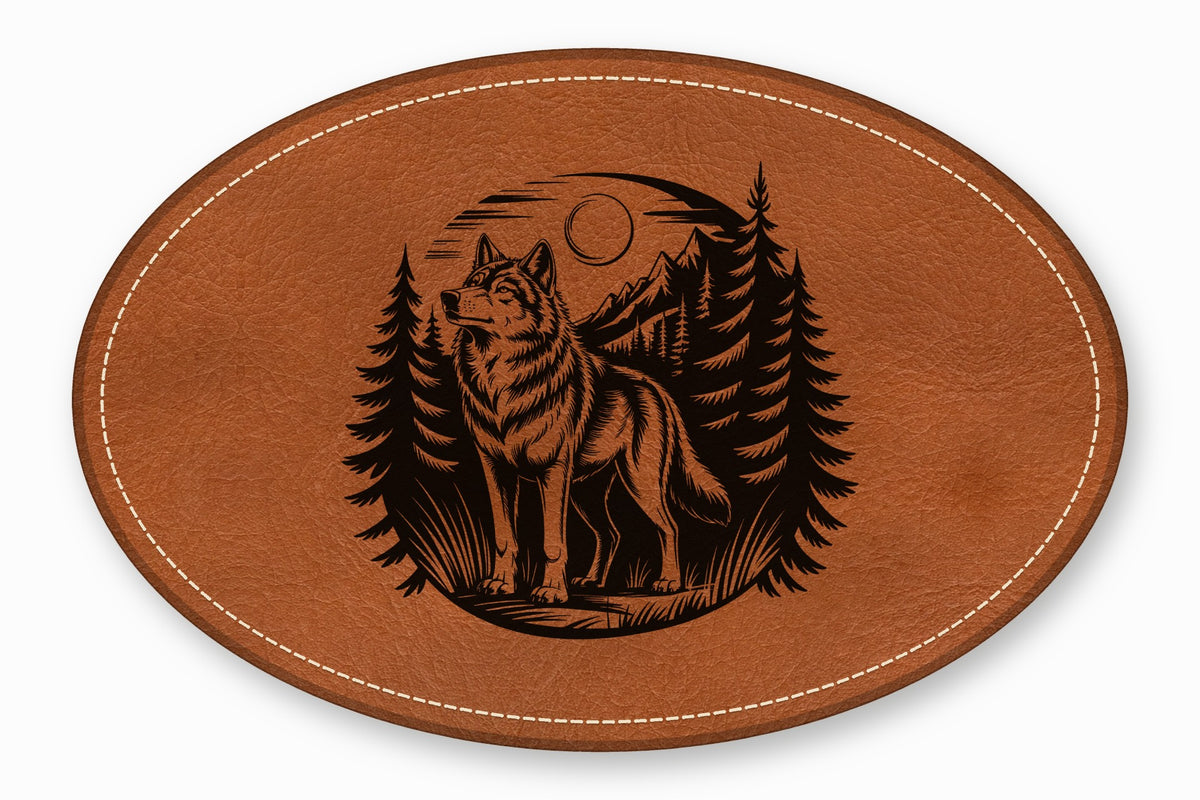 An oval brown leather patch featuring an engraved black illustration of a wolf in a forest.