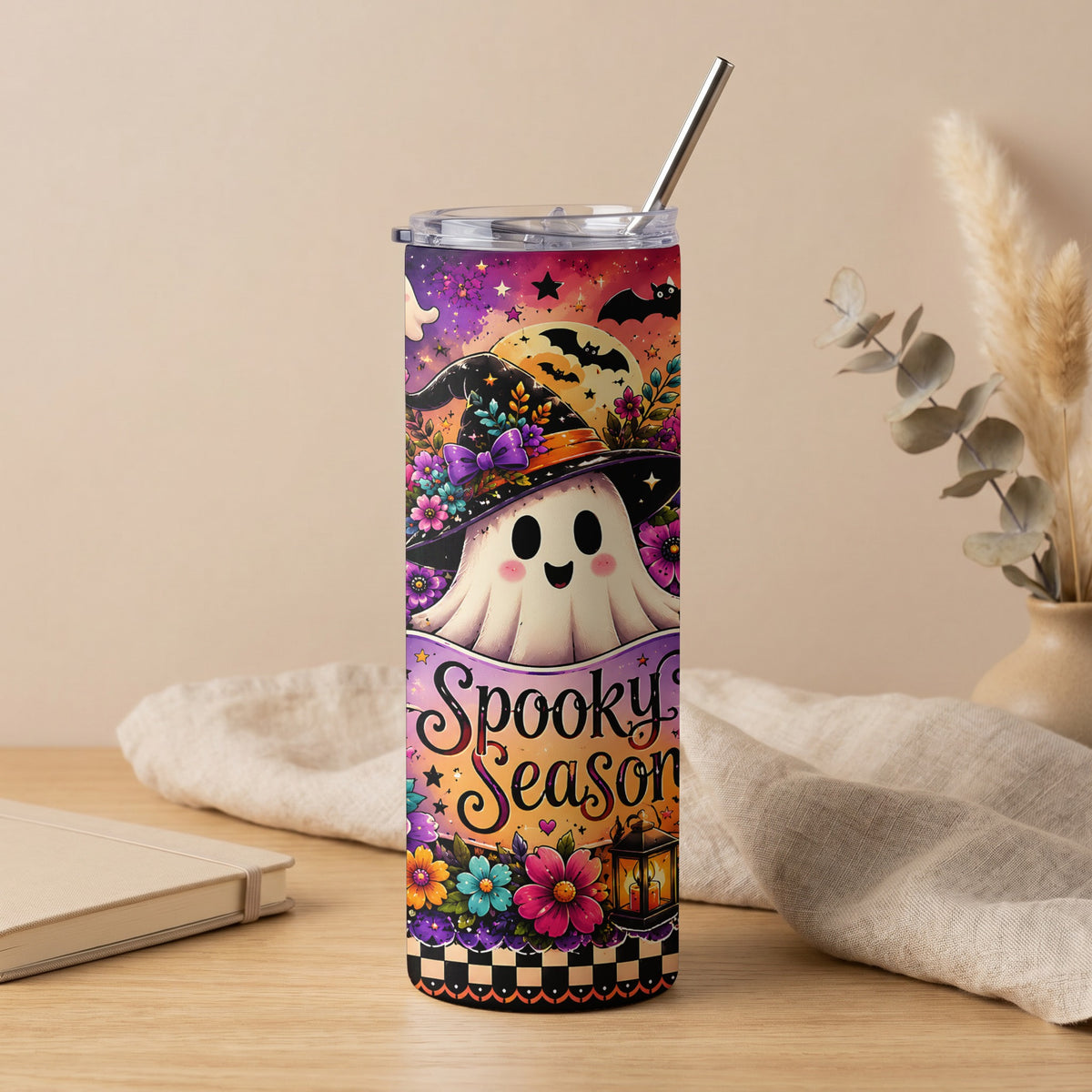 Halloween tumbler with ghost in witch hat and "Spooky Season" text.