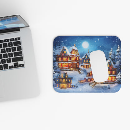Mousepad with a festive, snowy village scene illuminated by Christmas lights.