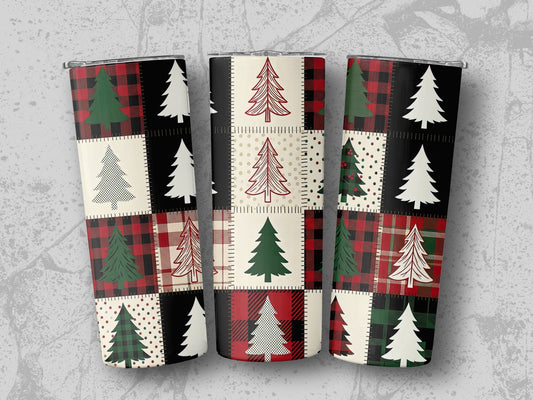 Three tumblers with a patchwork Christmas tree design on a grey background.