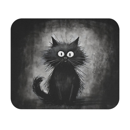 A mousepad features a whimsical black cat illustration with very wide eyes and frizzy fur against a textured grey background.