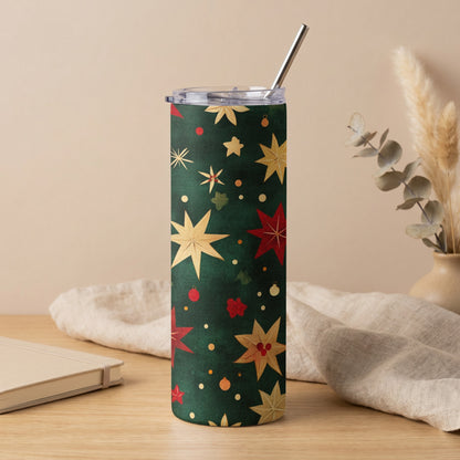 Green tumbler with a pattern of red and gold stars and festive ornaments.