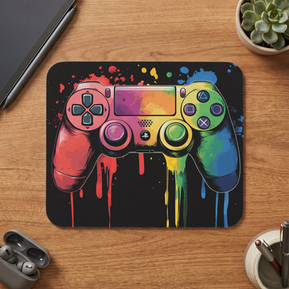 Video game controller with colorful paint splatter design on a black background.