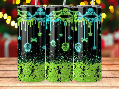 Three tumblers with Halloween-themed skeletons, skulls, and bones on a black sparkly background.
