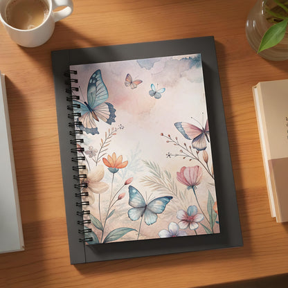 Spiral notebook with watercolor butterflies and floral design on cover.