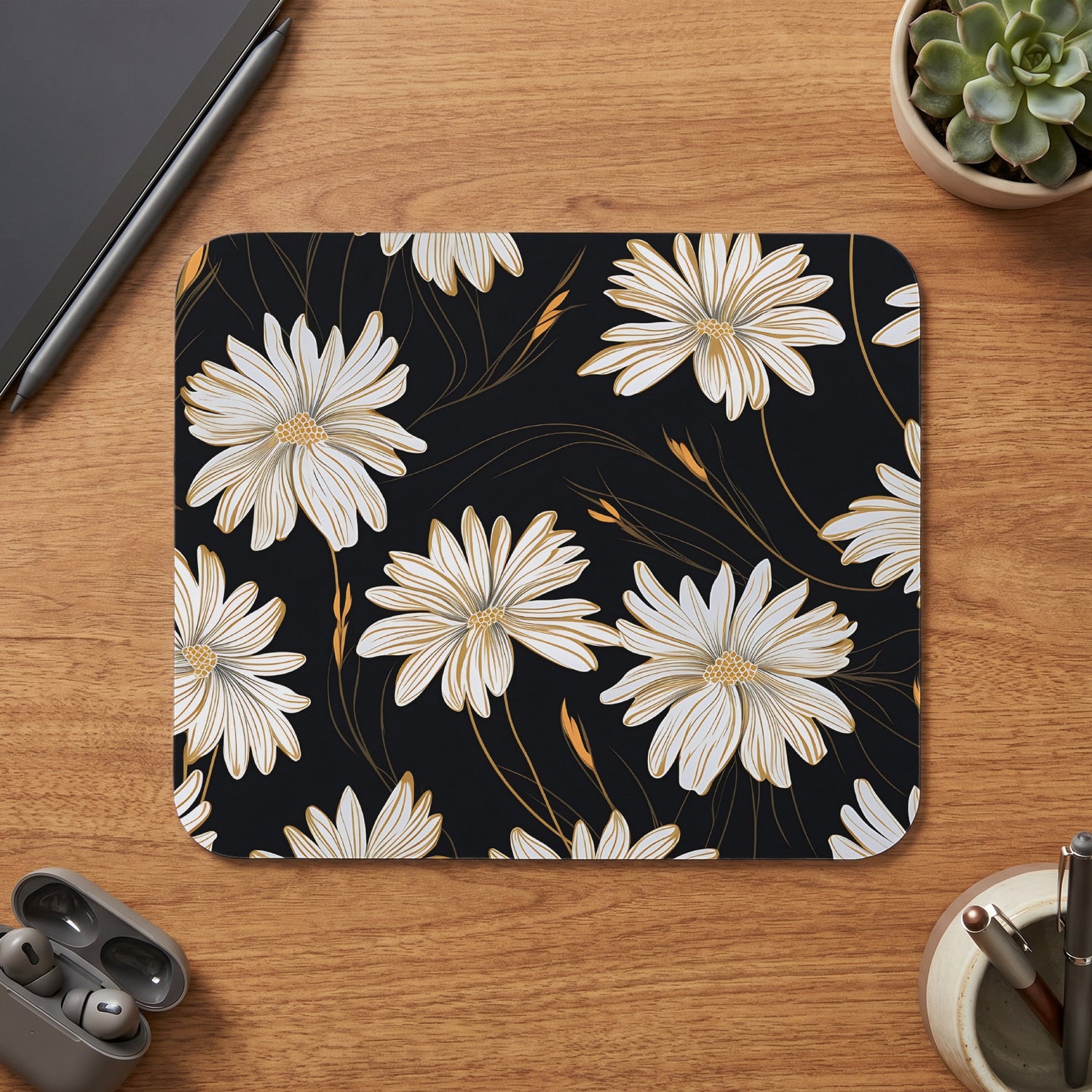 Mousepad with white and gold floral pattern on black background