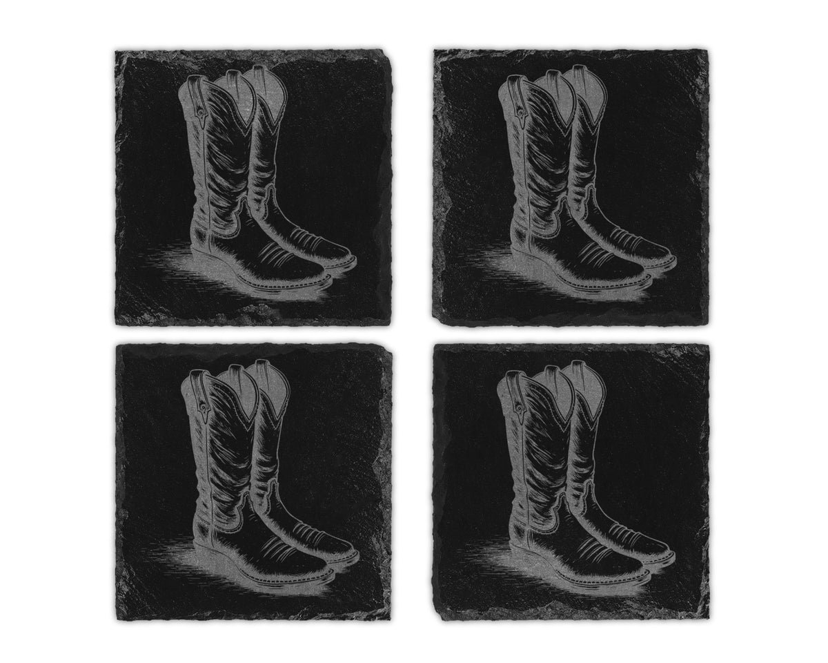 Four slate coasters each etched with a detailed drawing of cowboy boots.