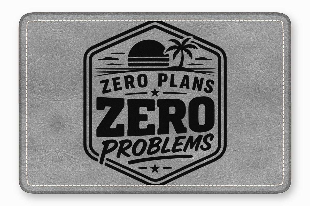 Grey leather patch with white stitched border and black stamped tropical design containing text ZERO PLANS ZERO PROBLEMS.