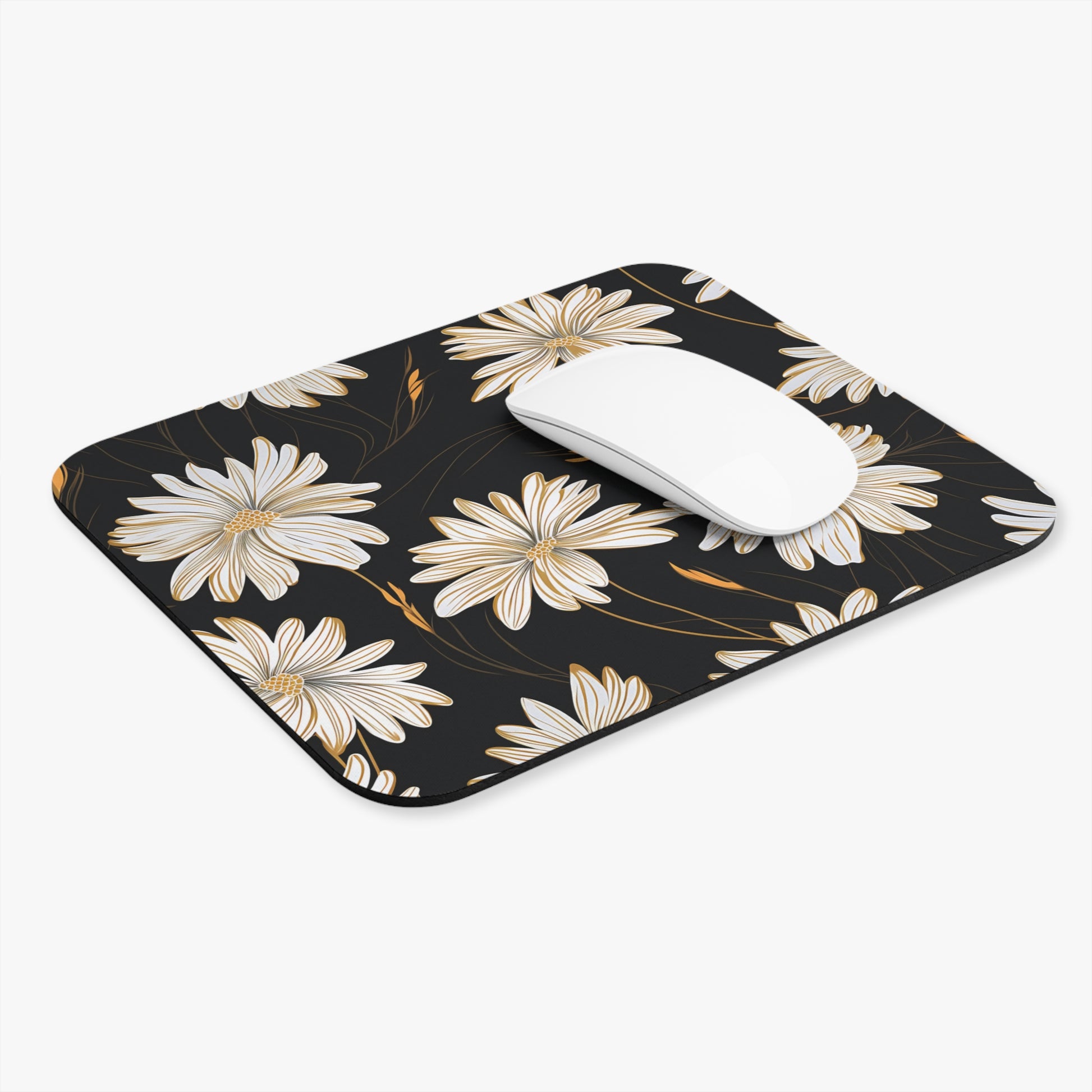 Black mousepad with white and gold floral pattern and a white mouse.