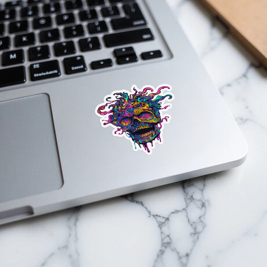 Colorful, trippy skull sticker with dripping effects on a laptop.