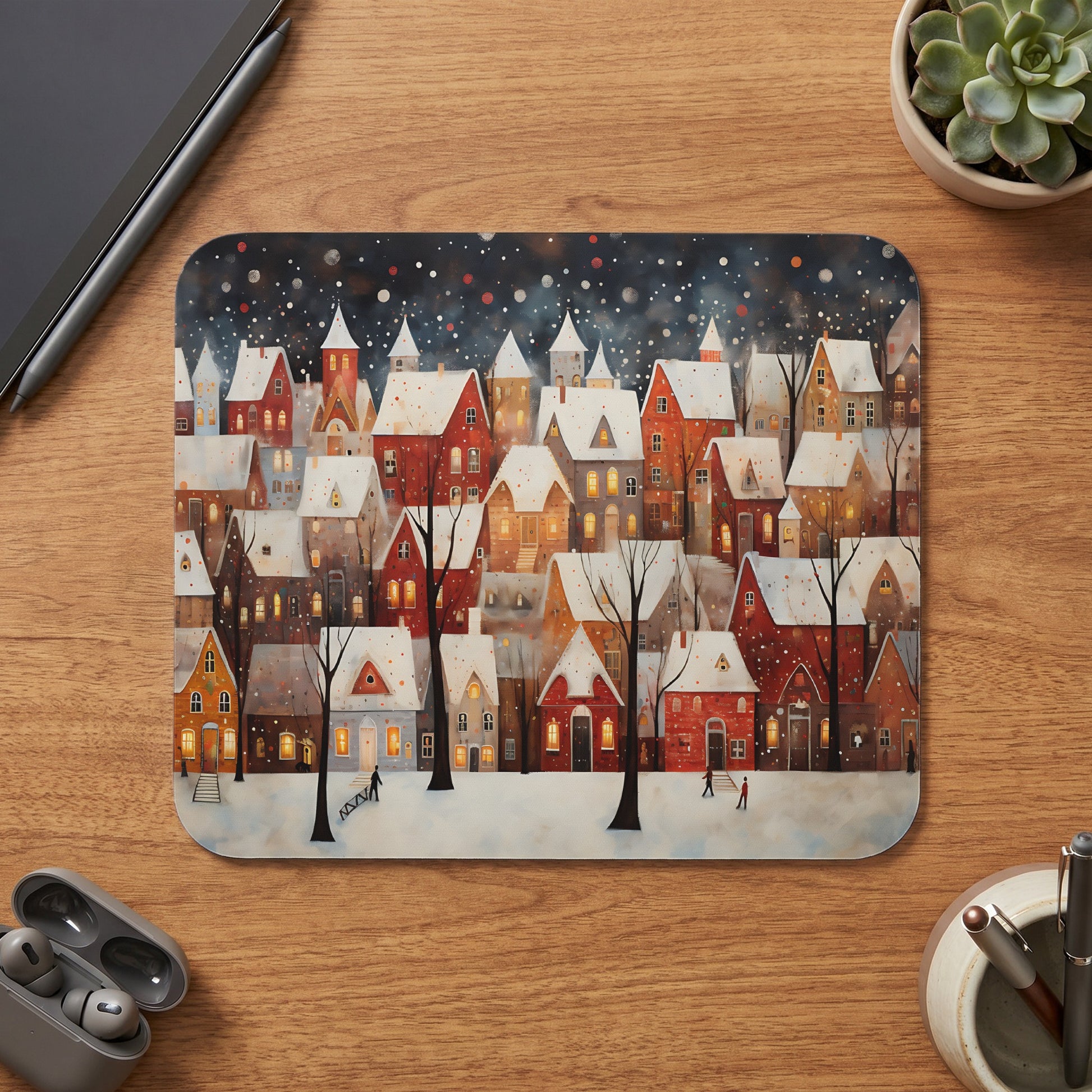 Watercolor illustration of a snowy village with red and white houses at night.