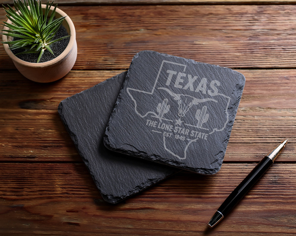 Engraved Texas slate coasters with longhorn skull and cacti designs.