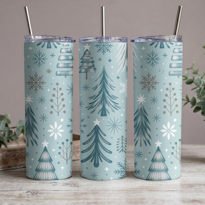 Three tumblers with a light blue background and a repeating Christmas tree and snowflake pattern.