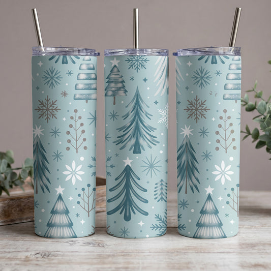 Three tumblers with a light blue background and a repeating Christmas tree and snowflake pattern.