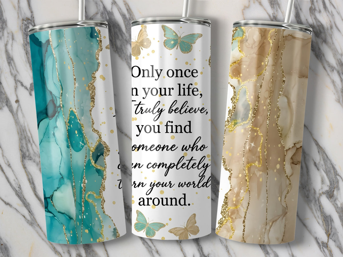 Three tumblers with marble, abstract, and glitter designs, featuring a quote and butterflies.