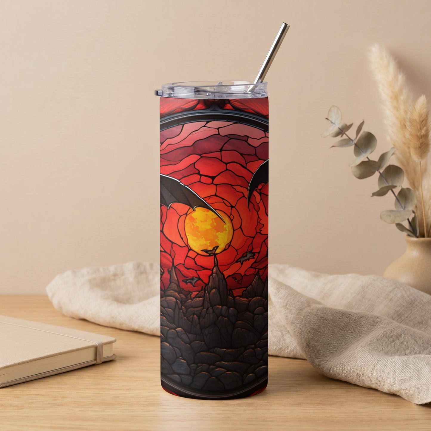 Tumbler with stained glass bats, moon, and castle at sunset.