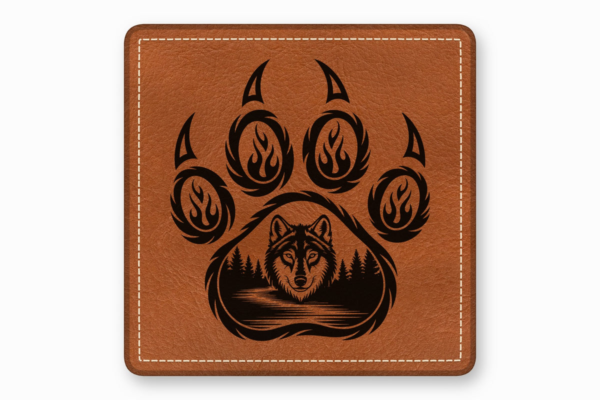 Square brown leather patch with white stitched border and a black laser-engraved wolf paw print design.