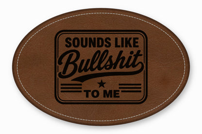 Brown oval leather patch featuring black text that reads Sounds Like Bullshit To Me.