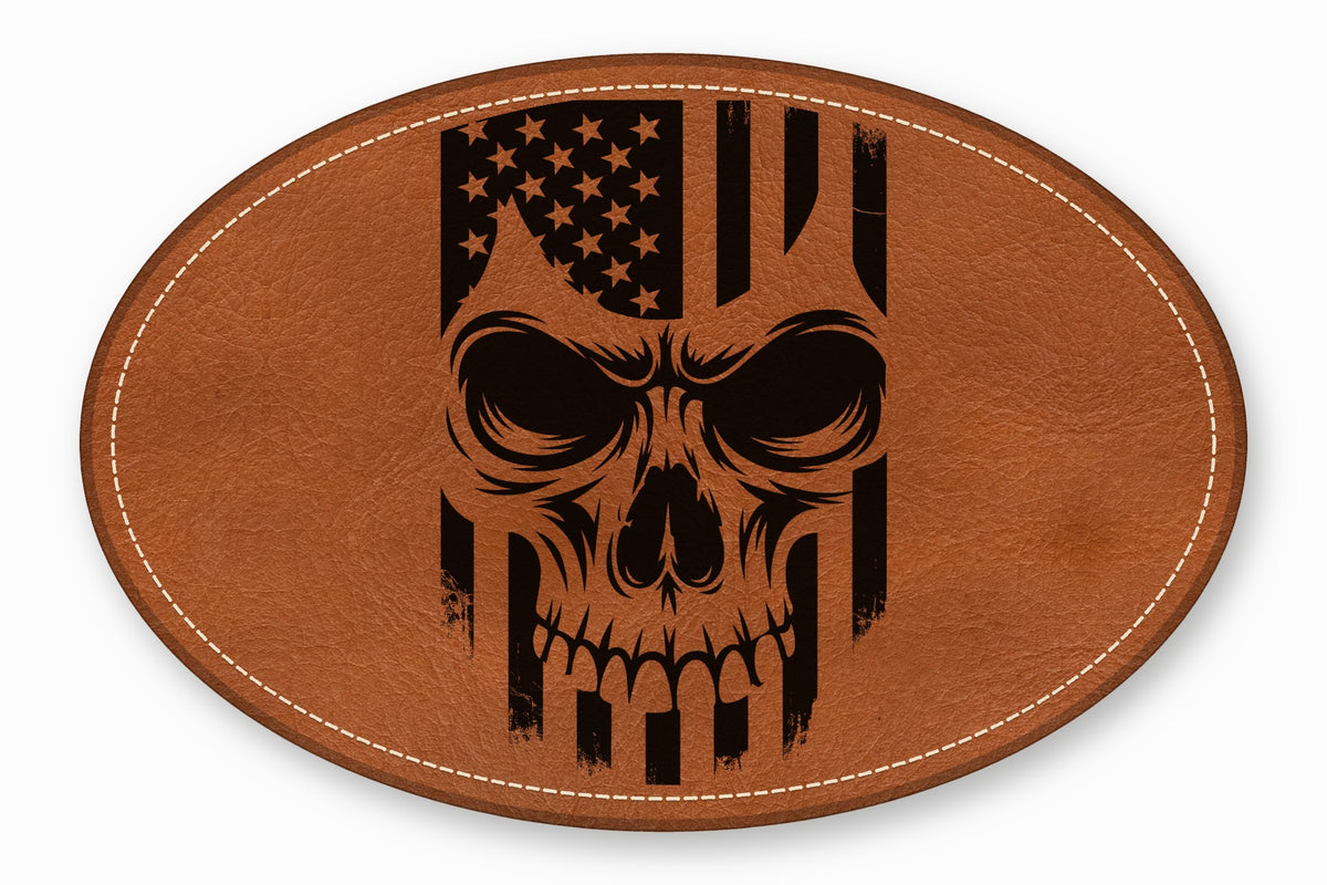 Oval brown leather patch with white stitched border featuring a black American flag skull design.