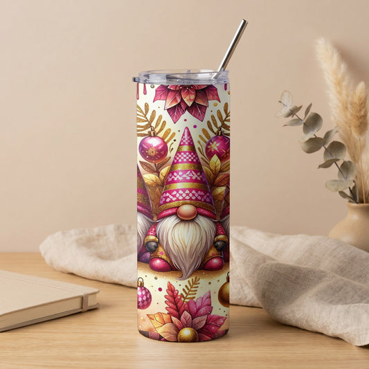 Tumbler with festive gnomes, poinsettias, and ornaments, featuring a metallic straw.