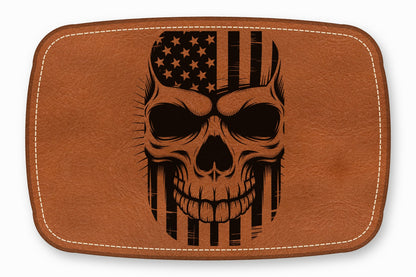 Brown leather patch with rounded corners and white stitching, featuring a black laser-engraved skull and American flag design.