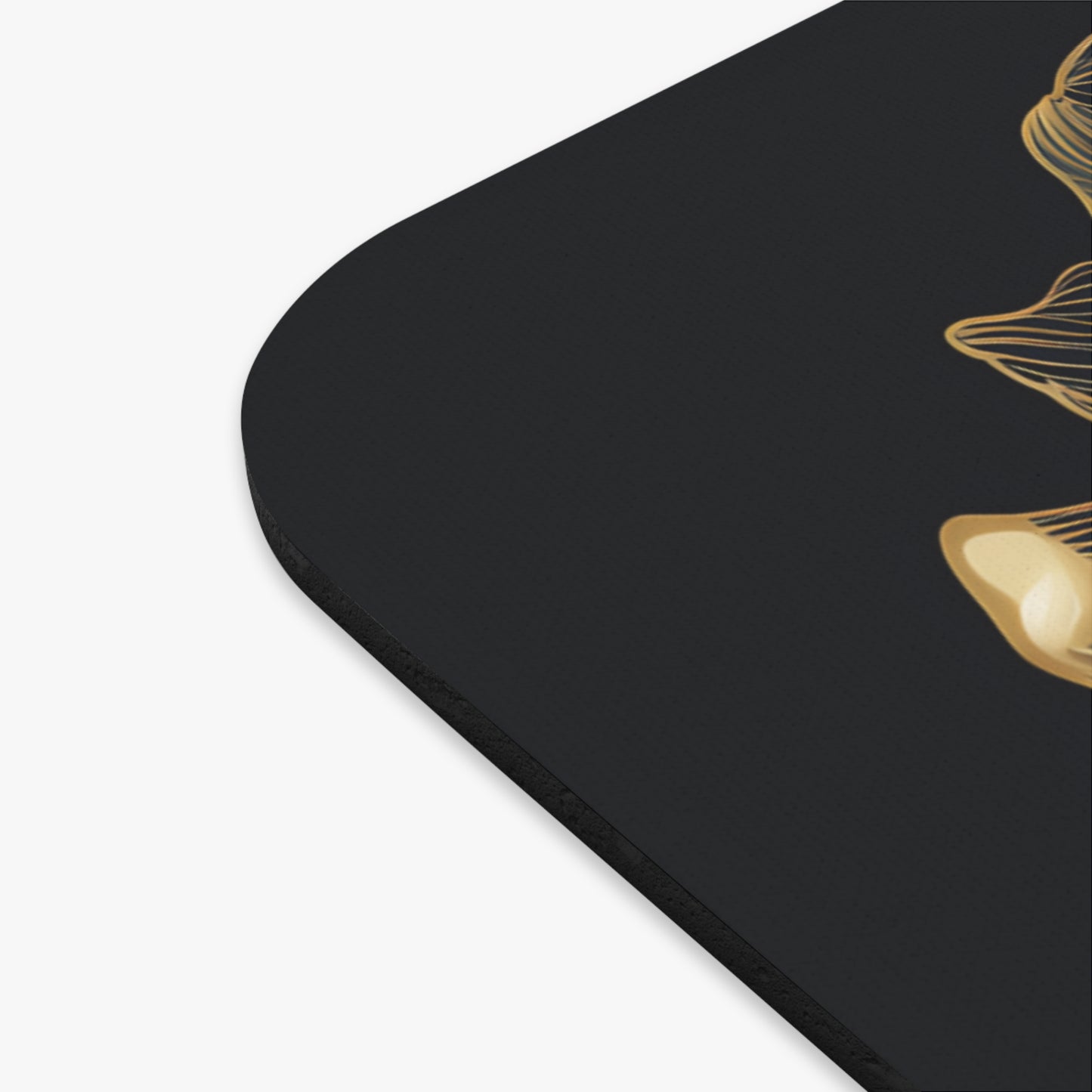 Black surface with abstract gold floral design.