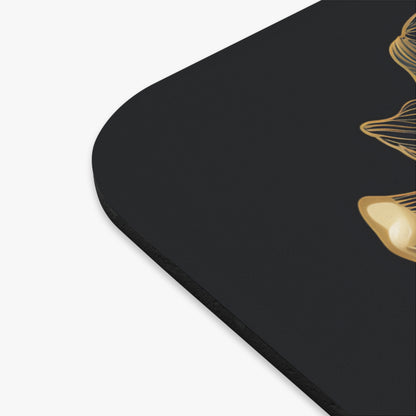 Black surface with abstract gold floral design.