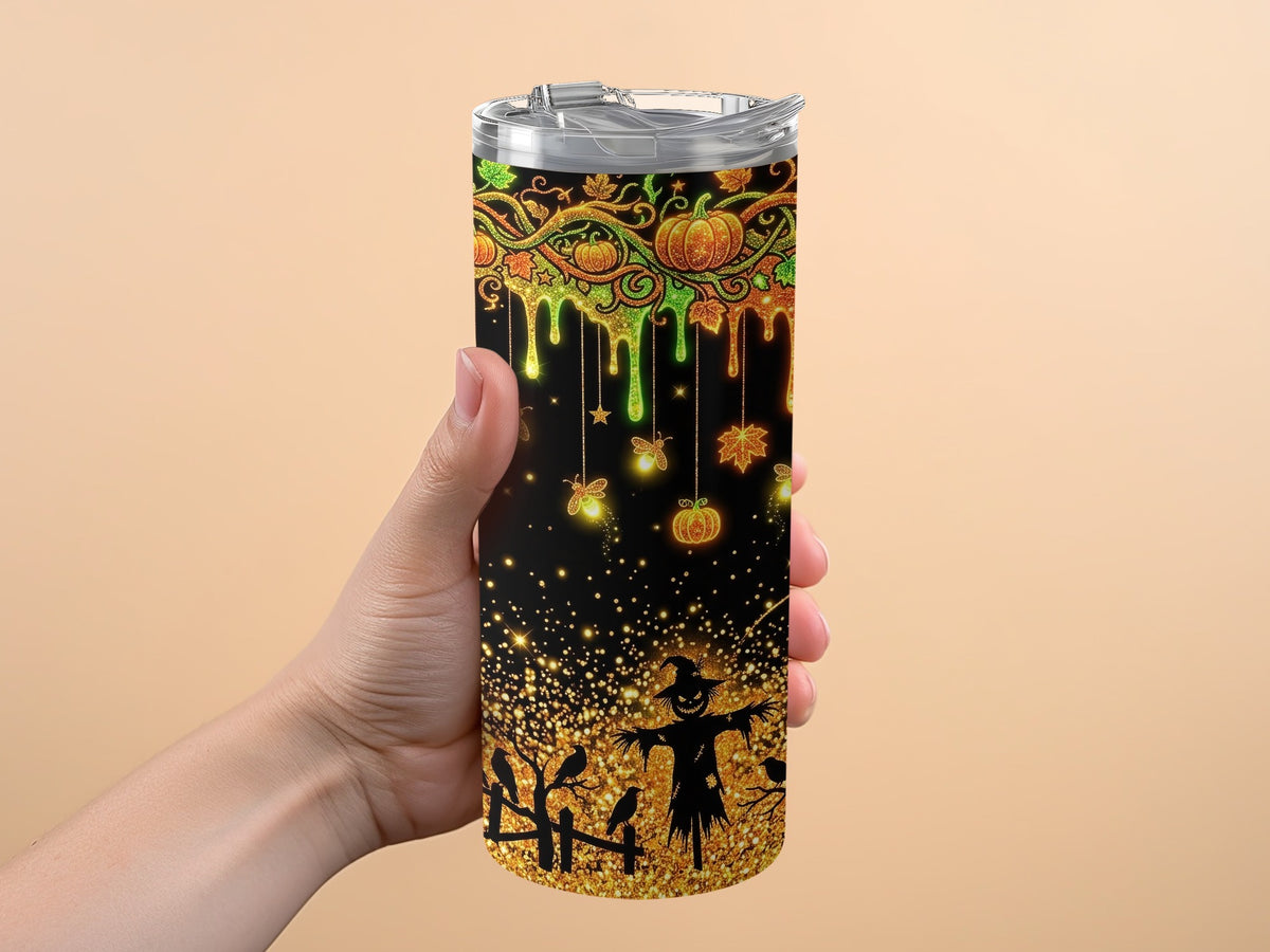 Halloween tumbler with pumpkins, bats, scarecrow, and glitter accents.