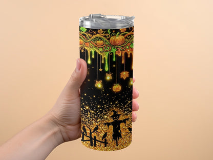 Halloween tumbler with pumpkins, bats, scarecrow, and glitter accents.