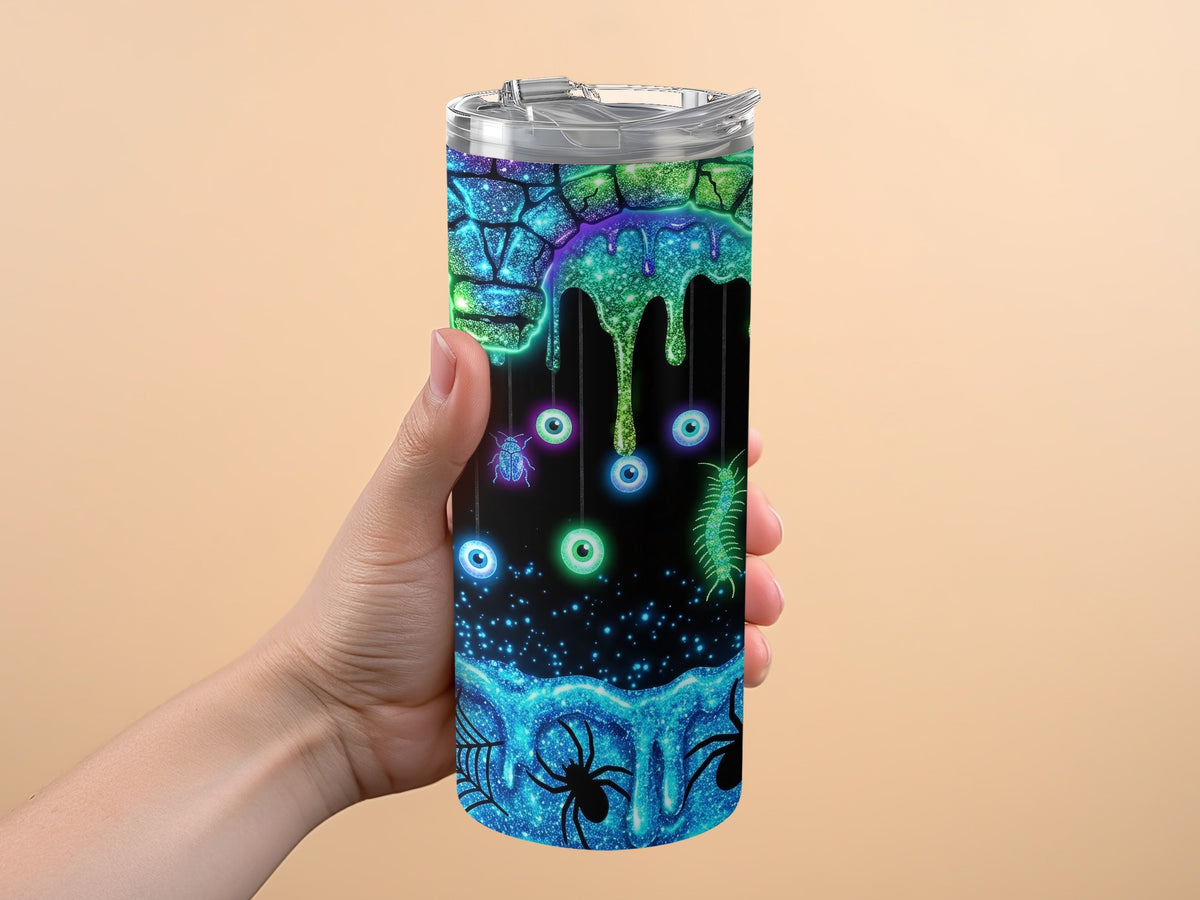 Tumbler with Halloween theme: glowing eyes, spiders, bugs, and dripping slime.