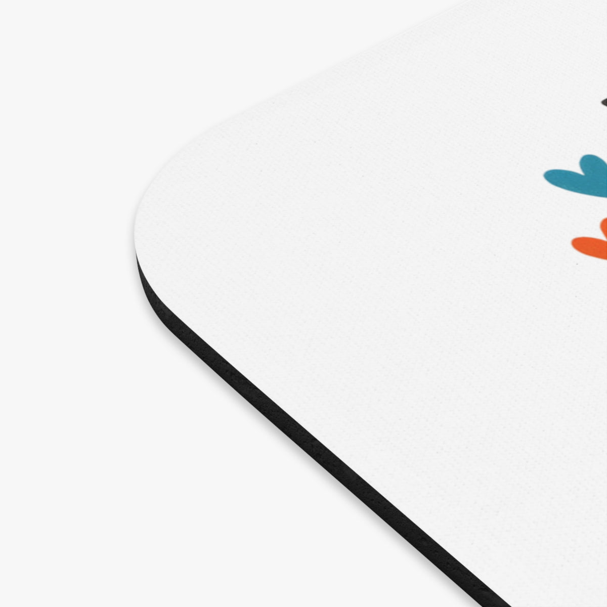 White mousepad with colorful abstract heart shapes and black trim.