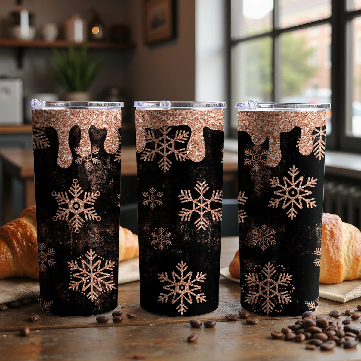 Three tumblers with rose gold glitter drip and snowflake pattern.