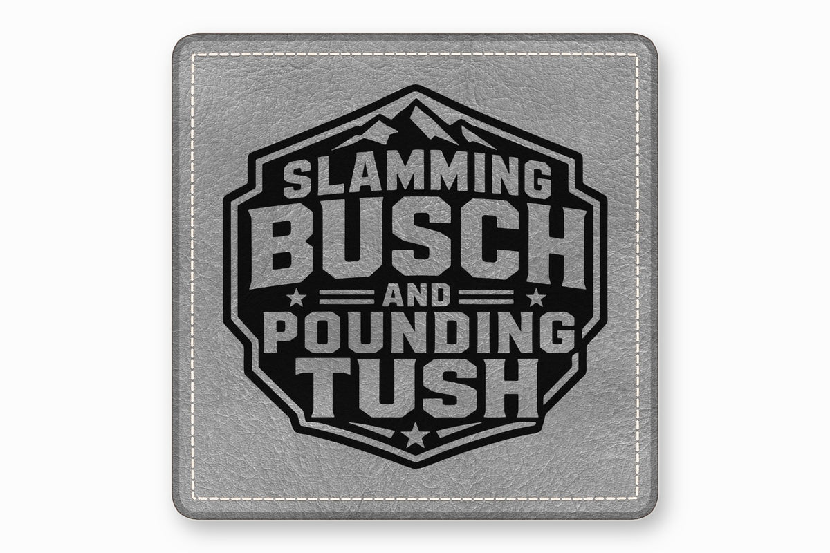Square grey faux leather patch with white stitched border and black emblem featuring mountain graphic and text Slamming Busch and Pounding Tush.