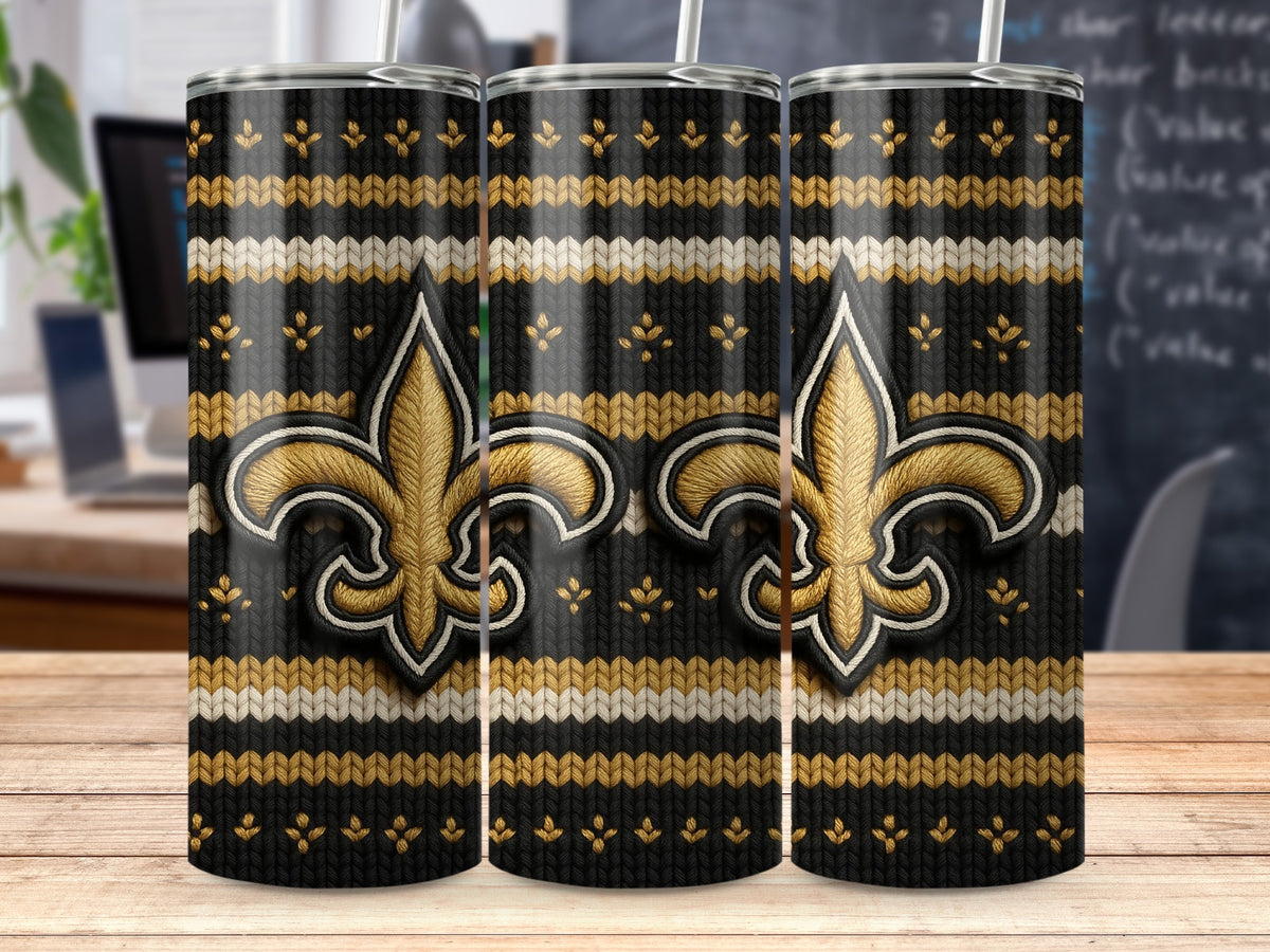 Three tumblers with a black, gold, and white knit pattern and fleur-de-lis symbols.
