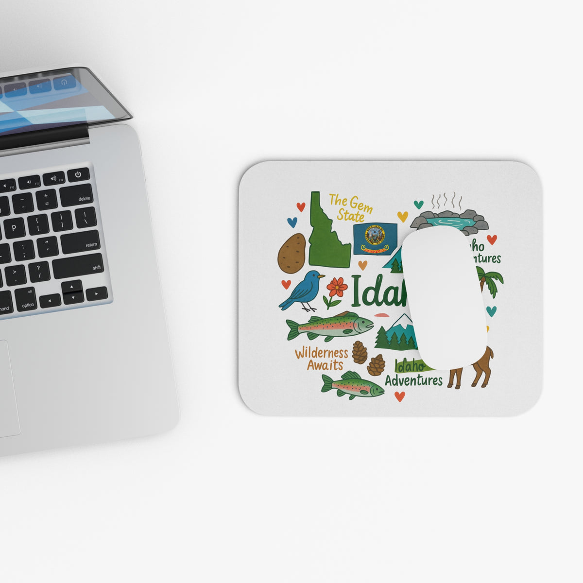 Mousepad with cartoon Idaho landmarks, state outline, fish, and text "Idaho".