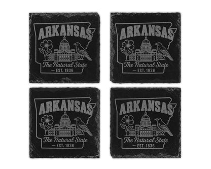 Four slate coasters each engraved with "Arkansas The Natural State Est. 1836".