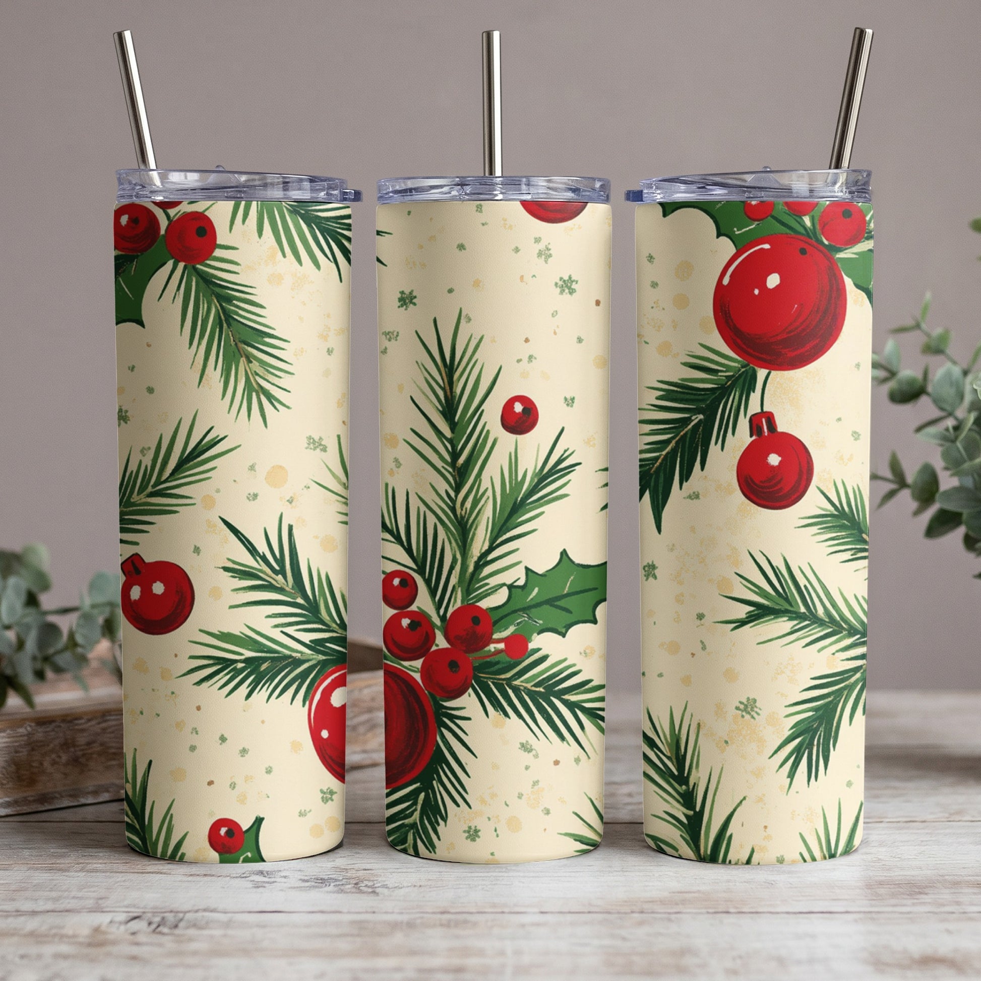 Three tumblers with a vintage Christmas pattern of holly and ornaments.