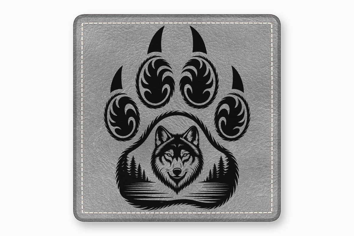 Gray leather patch with white stitching and a black graphic featuring a wolf face inside a paw print.