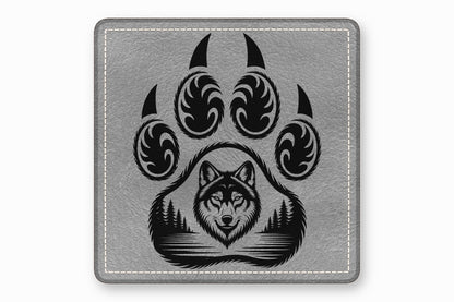Gray leather patch with white stitching and a black graphic featuring a wolf face inside a paw print.