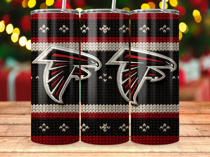Atlanta Falcons logo on a black, red, and white knit-patterned tumbler.